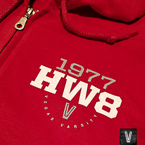 Closeup view of red zip up cotton hoodie with 1977 UNLV basketball team nickname Hardway Eight logo, HW8, on the left chest.