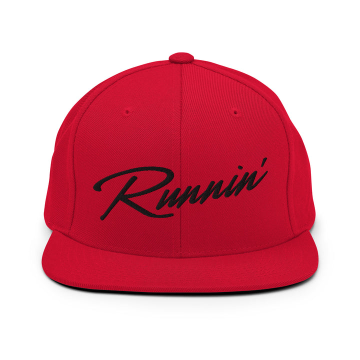 Front profile of red UNLV Runnin' Rebel basketball snapback hat with vintage style Runnin' in black script